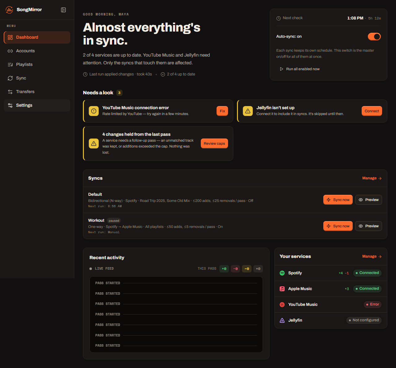 The SongMirror dashboard showing sync status, configured one-way and bidirectional sync jobs, a live activity feed, and connected Spotify, Apple Music, YouTube Music, and Jellyfin services